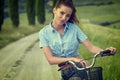 Beautiful vintage girl sitting next to bike, summer time Royalty Free Stock Photo