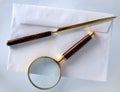 Magnifying glass and a letter opener Royalty Free Stock Photo