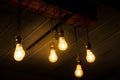 Beautiful vintage luxury light bulb hanging decor glowing in dark Royalty Free Stock Photo