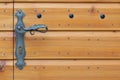Beautiful vintage metal handle on wooden texture door Royalty Free Stock Photo
