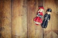 A beautiful vintage old pair dolls over a wooden background