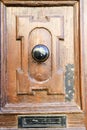 Beautiful vintage old wooden door with mail letter slot and iron door handle, Valletta, Malta