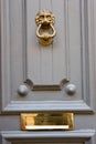 Beautiful vintage old wooden door with mail letter slot and iron door handle, Valletta, Malta