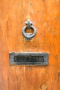 Beautiful vintage old wooden door with mail letter slot and iron door handle, Valletta, Malta