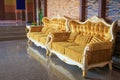 Beautiful vintage sofa next to wall Royalty Free Stock Photo