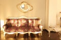 Beautiful vintage sofa next to wall Royalty Free Stock Photo