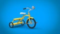 Beautiful vintage yellow tricycle - on blue background