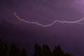 Beautiful violet lightning in the night sky. Royalty Free Stock Photo