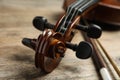 Beautiful violin and bow on wooden table