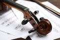 Beautiful violin and note sheets on table