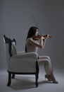 Beautiful Violinist Woman playing electric violin on white backg Royalty Free Stock Photo