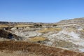 Beautiful vistas of a golf course in the badlands surrounded by canyons, hoodoos, coulees and mountains outside of Drumheller