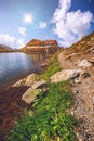 Beautiful volcanic Balea lake at high altitude, on Fagaras mountain, Romania Royalty Free Stock Photo