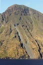 Beautiful volcanic island with green vegetation in the Mediterranean Sea on a clear sunny day Royalty Free Stock Photo