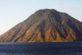 Beautiful volcanic island with green vegetation in the Mediterranean Sea on a clear sunny day Royalty Free Stock Photo