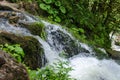 Beautiful wallpaper milk waterfall flow rapid stream. Caucasus rocky mountain river in forest. Isichenko waterfall, Guamka, Mezmay