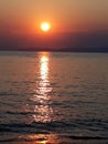Beautiful warm colour sunrise with reflection on the sea