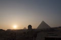 Sunset at The Sphinx and The Great Pyramids of Egypt Royalty Free Stock Photo