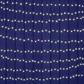 Beautiful Warm White String Lights on Dark Blue Wood Texture