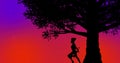 Beautiful warrior girl standing under a tree during sunset time orange-purple background Royalty Free Stock Photo