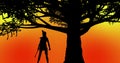 Beautiful warrior girl standing under a tree during sunset time orange-yellow background