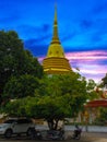 Beautiful Wat Buddhist temples in Phuket Thailand. Decorated in beautiful ornate colours of red and Gold and Blue. Lovely sunset