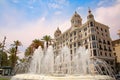 Beautiful water fountain along the waterfront of the city with historic traditonal buildings, Explanada de Espana, Alicante, Spain