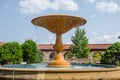 Beautiful water fountain in a flower garden