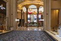 A beautiful water fountain with statues, Chinese lanterns, gold coins and lush green plants at The Venetian Resort and Hotel