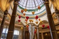 A beautiful water fountain with statues, tall pillars, Chinese lanterns and lush green plants at The Venetian Resort and Hotel l