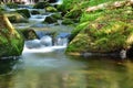 Beautiful water stream, boulders covered with moss Royalty Free Stock Photo