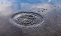 Beautiful water waves and ripples from a drop falling into a water surface of a lake Royalty Free Stock Photo