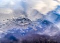 Beautiful water waves and ripples from a drop falling into a water surface of a lake Royalty Free Stock Photo