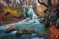 Beautiful waterfall in autumn forest in crimean mountains at sun Royalty Free Stock Photo