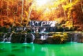 Beautiful waterfall in autumn, rocks and stones in autumn