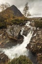 Beautiful Waterfall At Buachaille Etive Mor In The Scottish Highlands on cloudy weather Royalty Free Stock Photo
