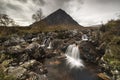 Beautiful Waterfall At Buachaille Etive Mor In The Scottish Highlands on cloudy weather Royalty Free Stock Photo