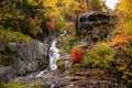 Stunning autumn colours around a beautiful waterfall Royalty Free Stock Photo