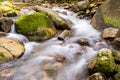 Beautiful waterfall deep in the forest. cool and clean water falling in the stone. concept nature and travel Royalty Free Stock Photo