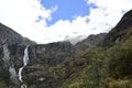 A beautiful waterfall falls from a high mountain, on the way to Lagoon 69. Huascaran National Park in the Sands of Peru Royalty Free Stock Photo