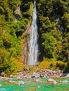 Beautiful waterfall in flowing river in New Zealand