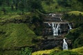 A beautiful waterfall among the green mountains Royalty Free Stock Photo