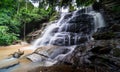 Beautiful waterfall in green tropical forest. View of the falling water with splash in rain season know as name Tad Mok, Chiang Royalty Free Stock Photo