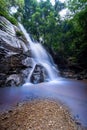 Beautiful waterfall in green tropical forest. View of the falling water with splash in rain season know as name Tad Mok, Chiang Royalty Free Stock Photo