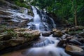 Beautiful waterfall in green tropical forest. View of the falling water with splash in rain season know as name Tad Mok, Chiang Royalty Free Stock Photo