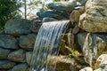 Beautiful waterfall in Japanese garden. Public landscape park of Krasnodar or Galitsky Park, Russia Royalty Free Stock Photo