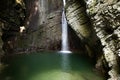 Beautiful waterfall kozjak falling into a green pool or lake Royalty Free Stock Photo