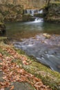 Beautiful waterfall landscape image in forest during Autumn Fall Royalty Free Stock Photo