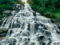 Beautiful waterfall in lush tropical green forest. Nature landscape. Mae Ya Waterfall is situated in Doi Inthanon National Park, Royalty Free Stock Photo