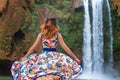 Beautiful waterfall in Morocco. Back of woman in beautiful dress looking fall Ouzoud. Exotic nature of North Africa, Royalty Free Stock Photo